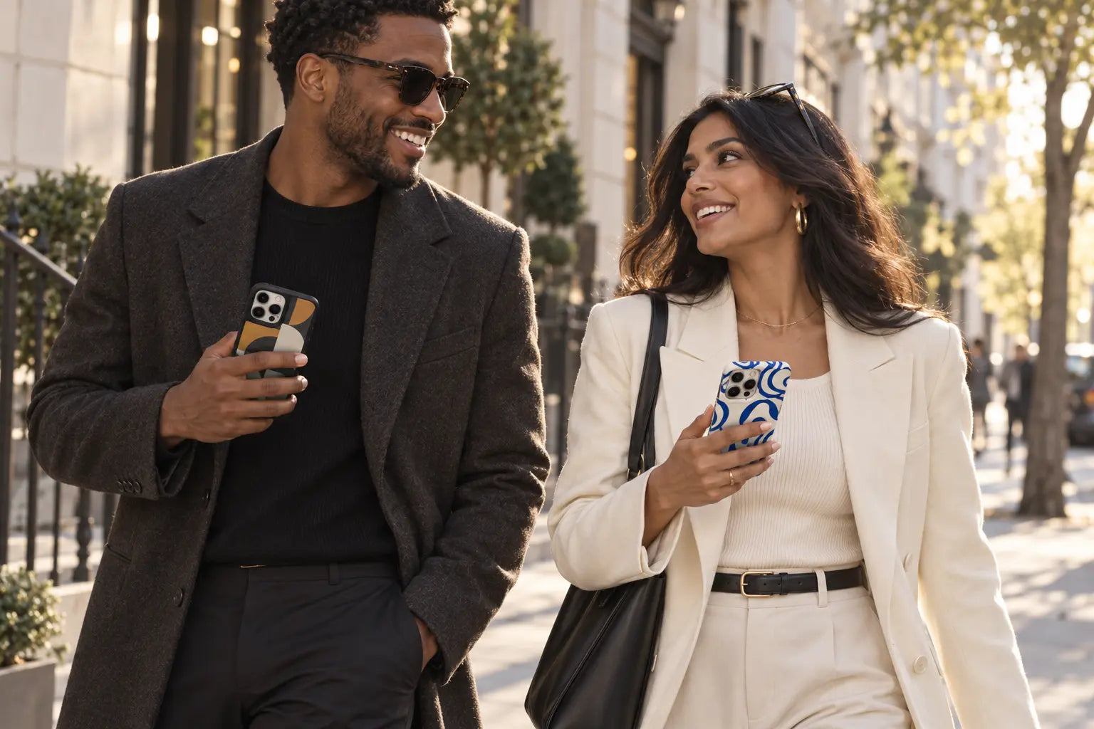 Two friends walking through the city with original geometric and abstract patterned phone cases