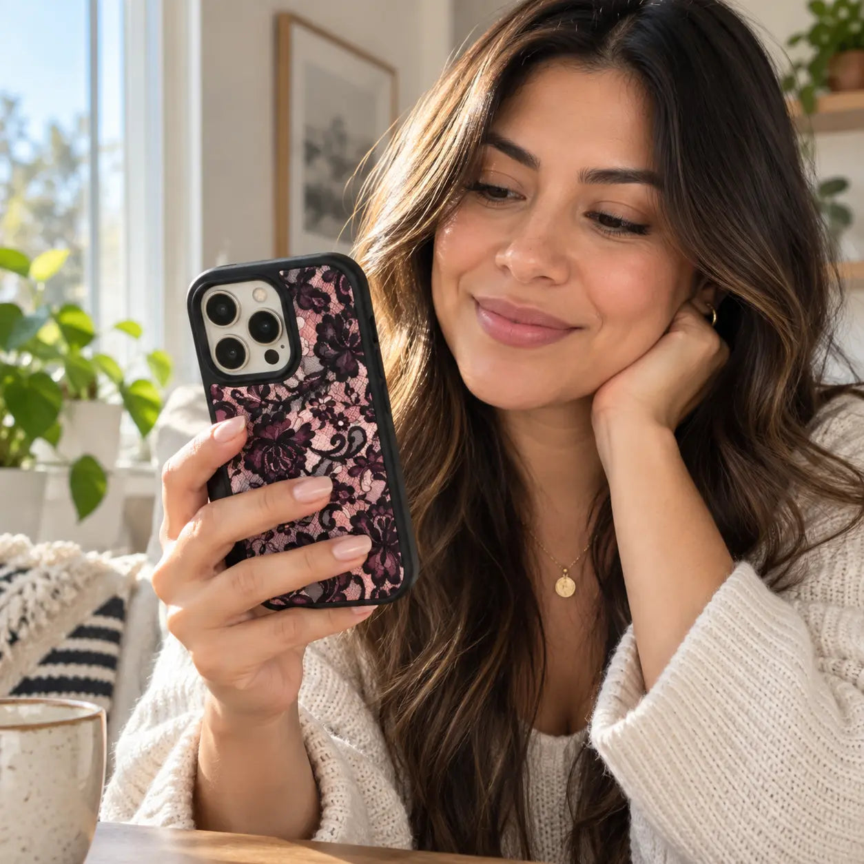 Woman holding a patterned Black Bumper phone case